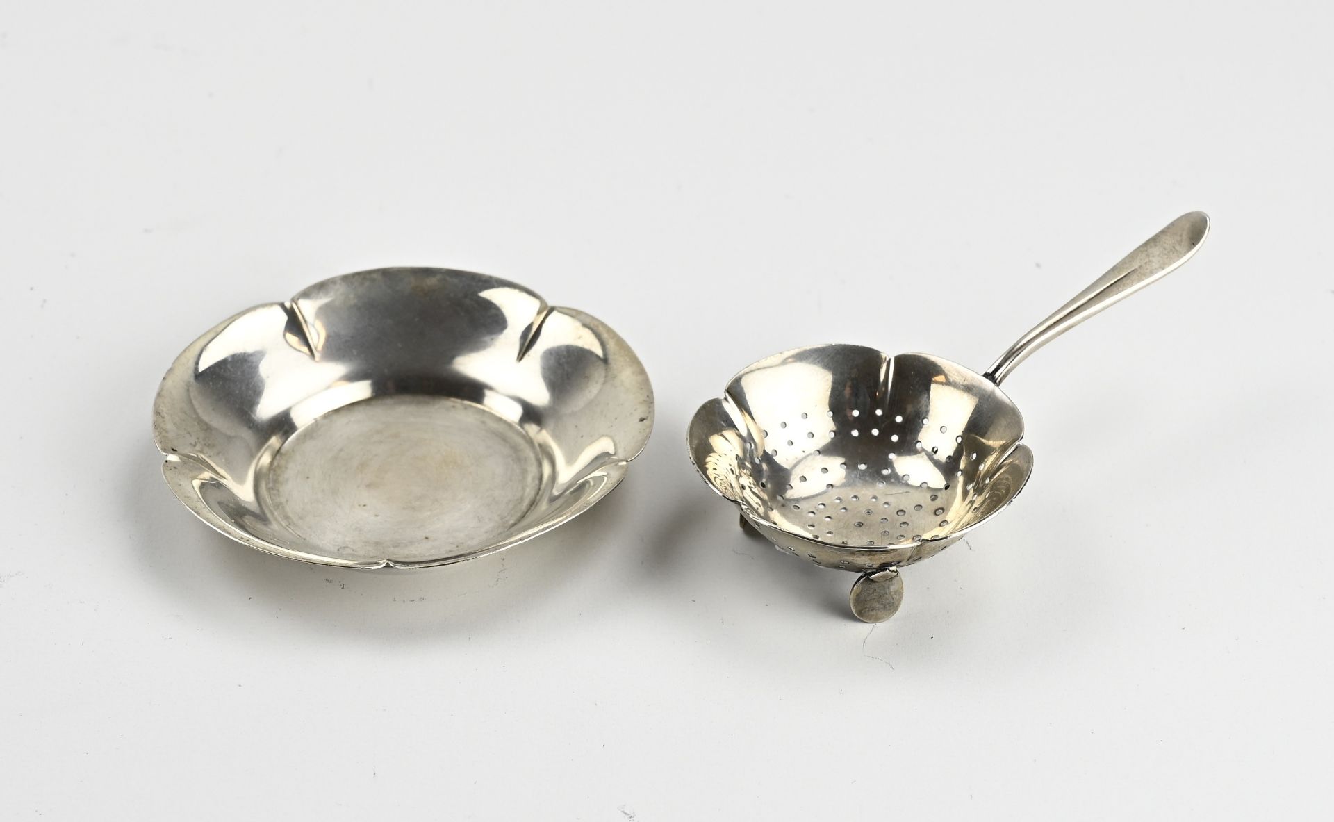 Silver tea strainer with drip tray