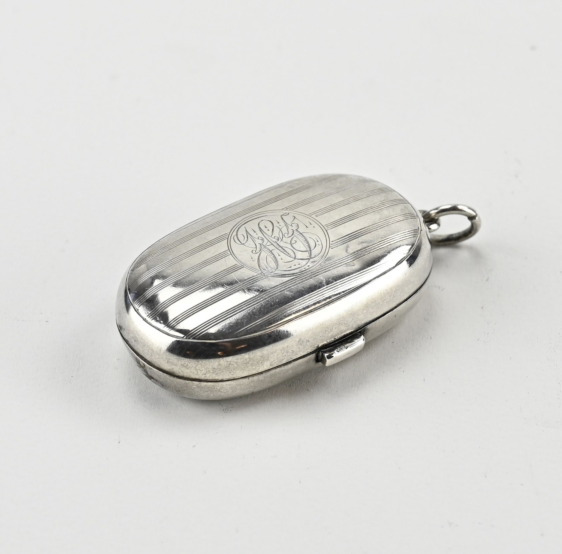 Silver oval coin box