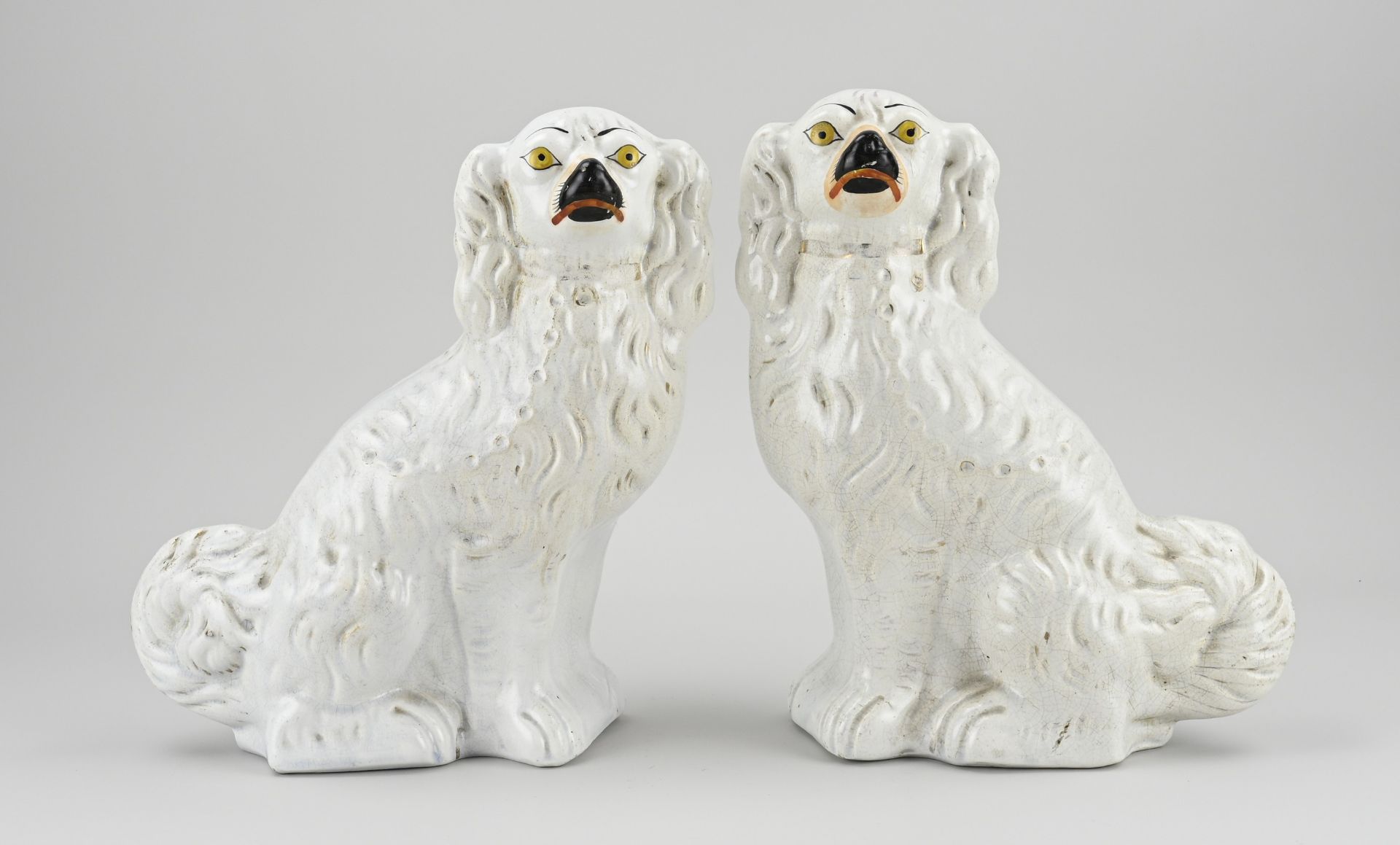 Two antique Staffordshire dogs, 1900