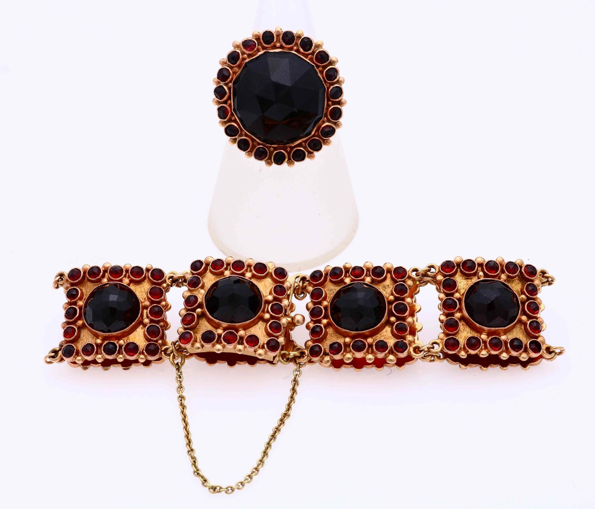 Gold bracelet and ring with garnet