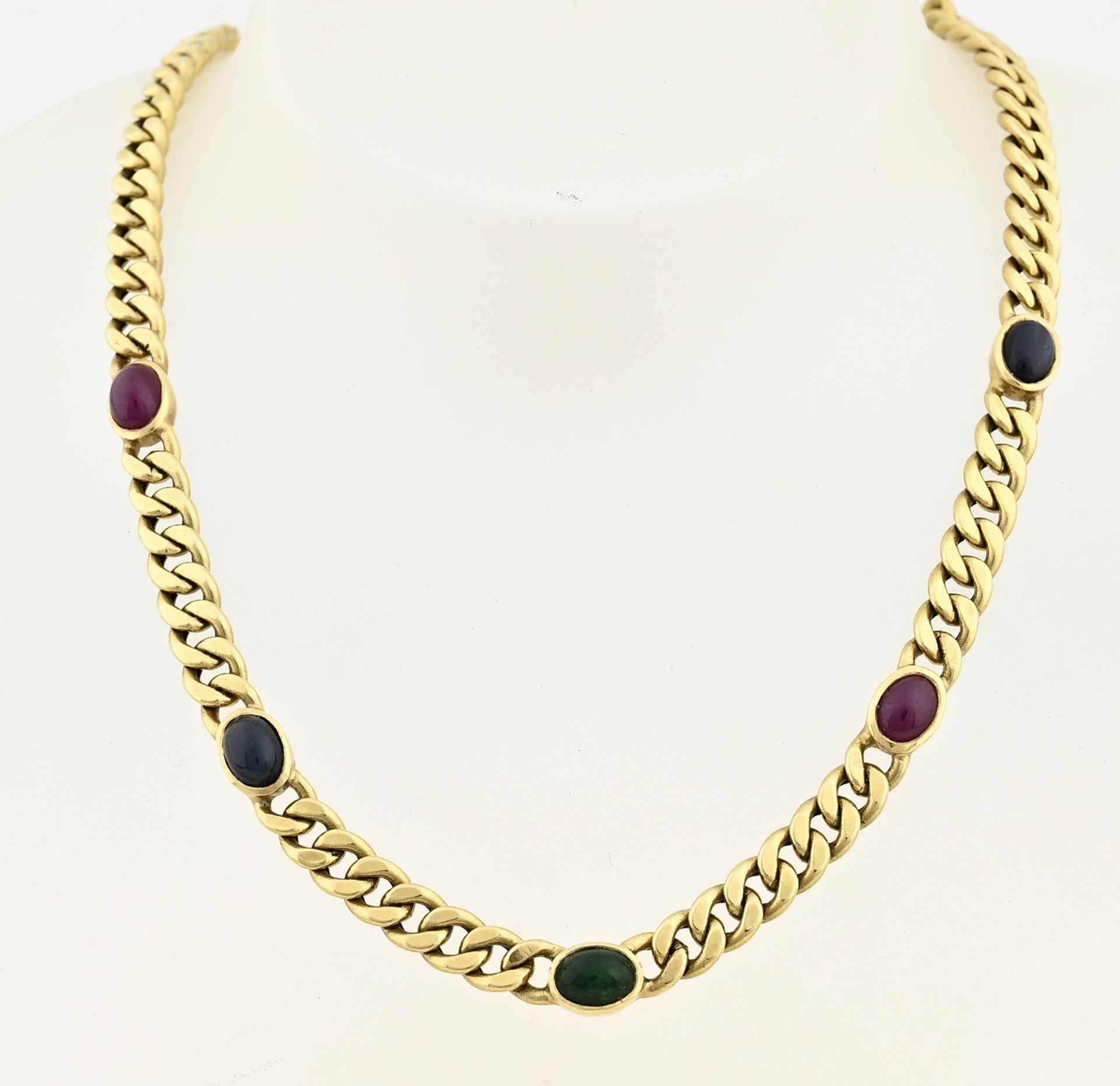 Gold choker with ruby sapphire and emerald