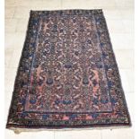 Hand-knotted Persian carpet, 180 x 106 cm.