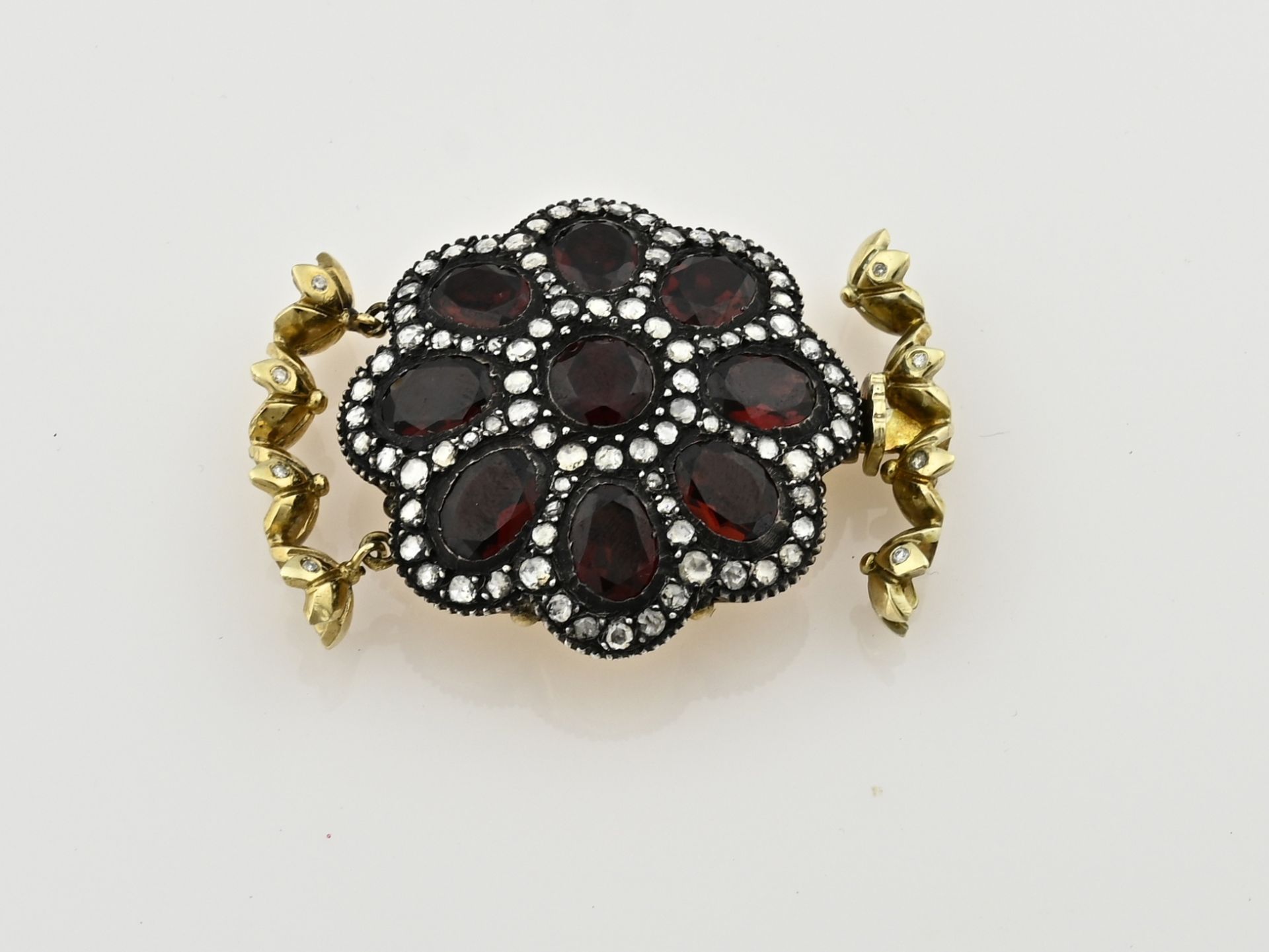 Gold lock with garnet and diamond