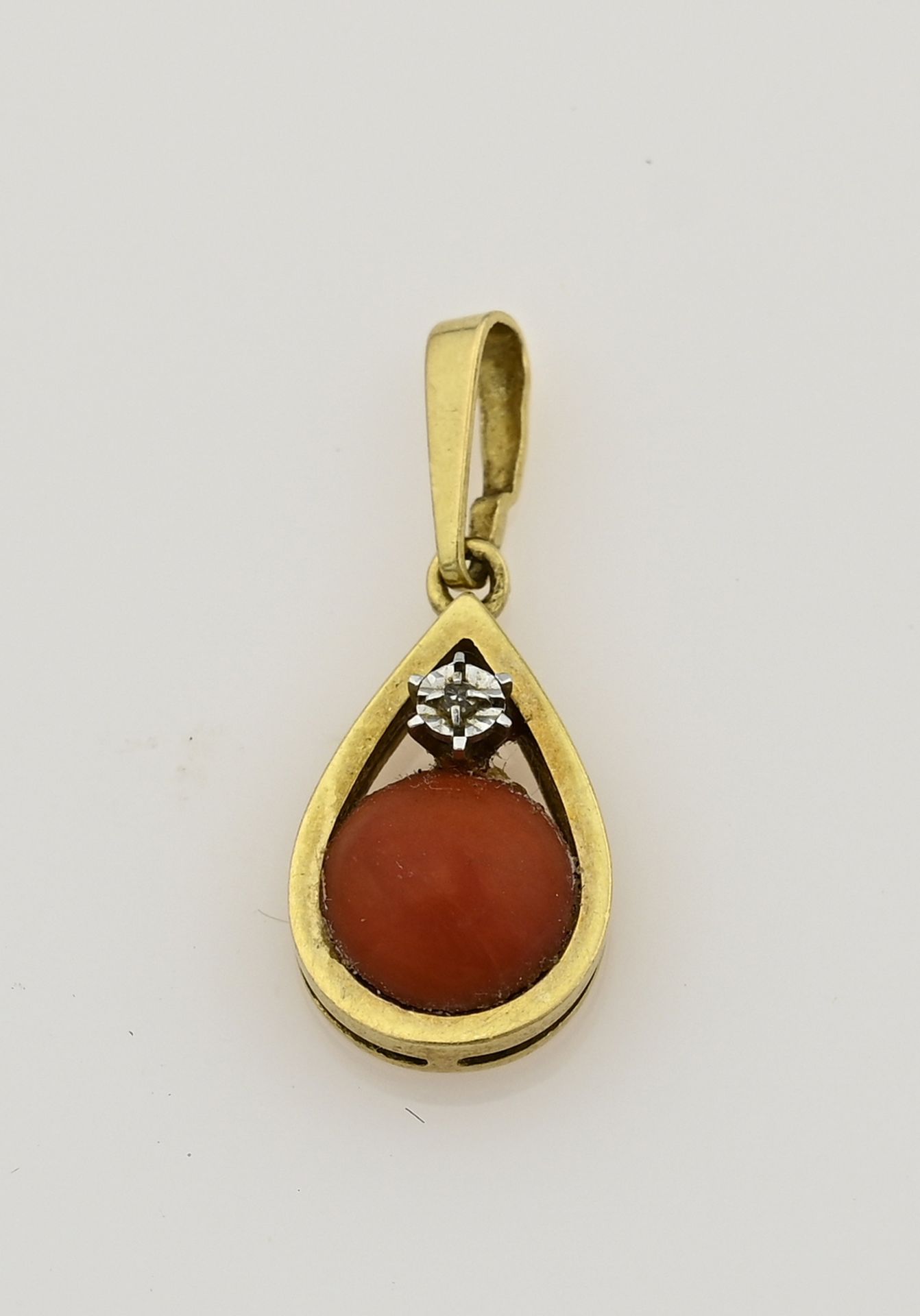 Gold pendant with red coral