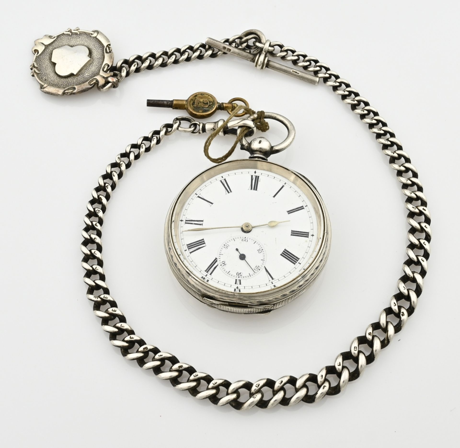 Silver pocket watch with chain