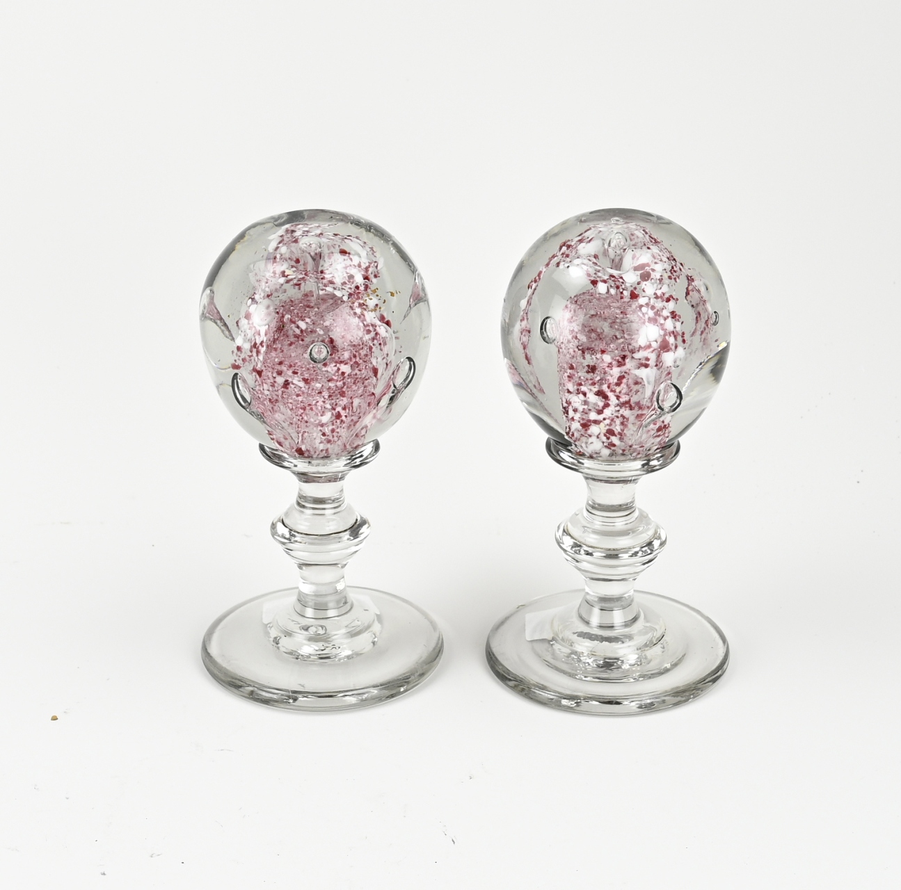 Two glass paperweights, H 17.5 cm.