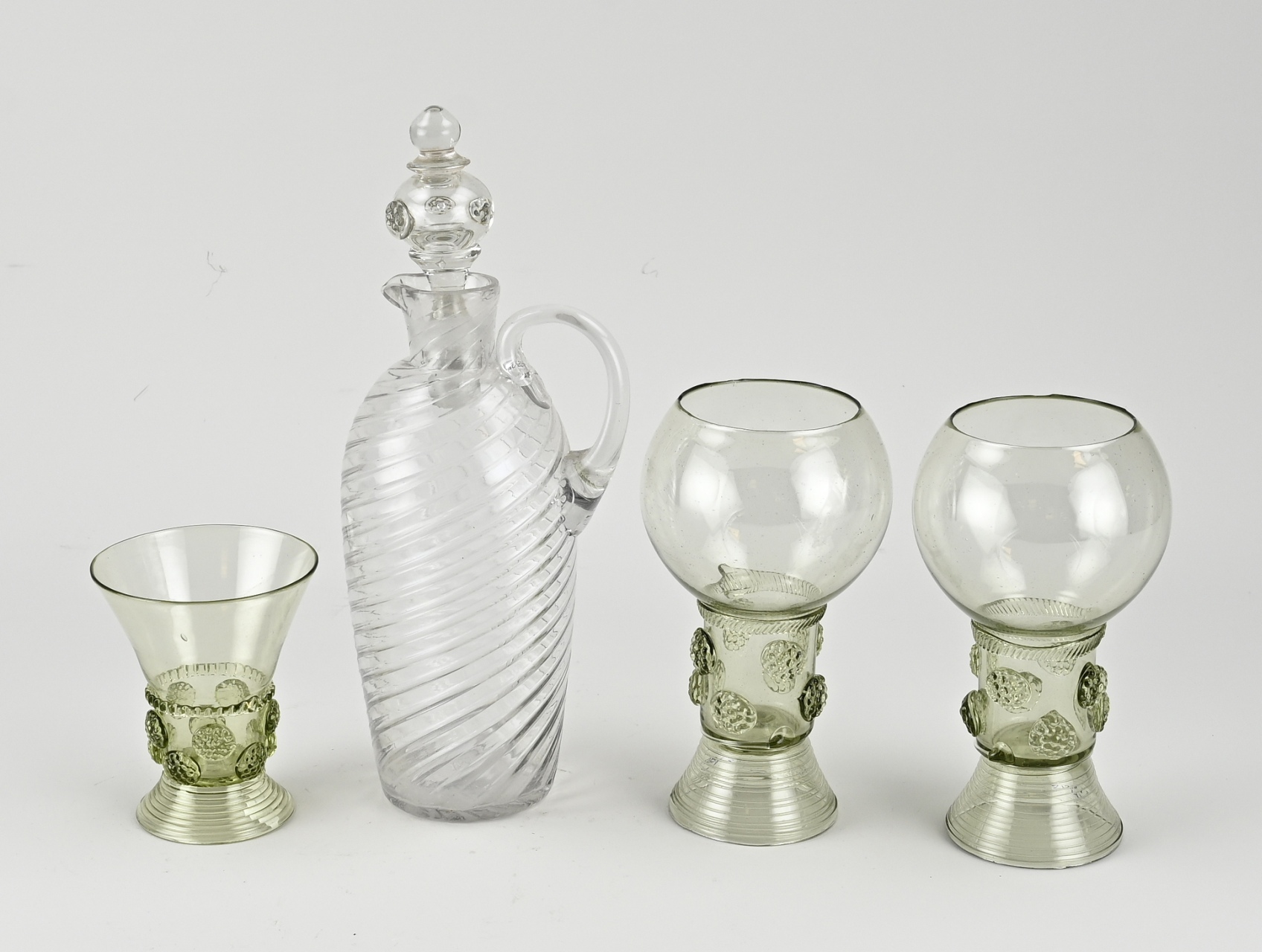 Four volumes of old glassware