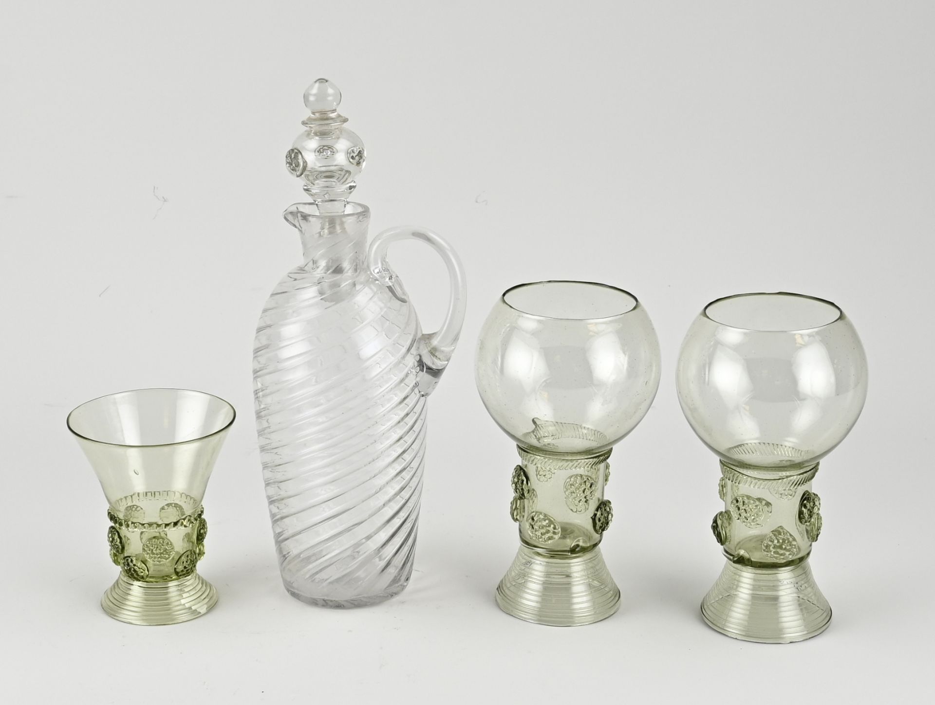 Four volumes of old glassware