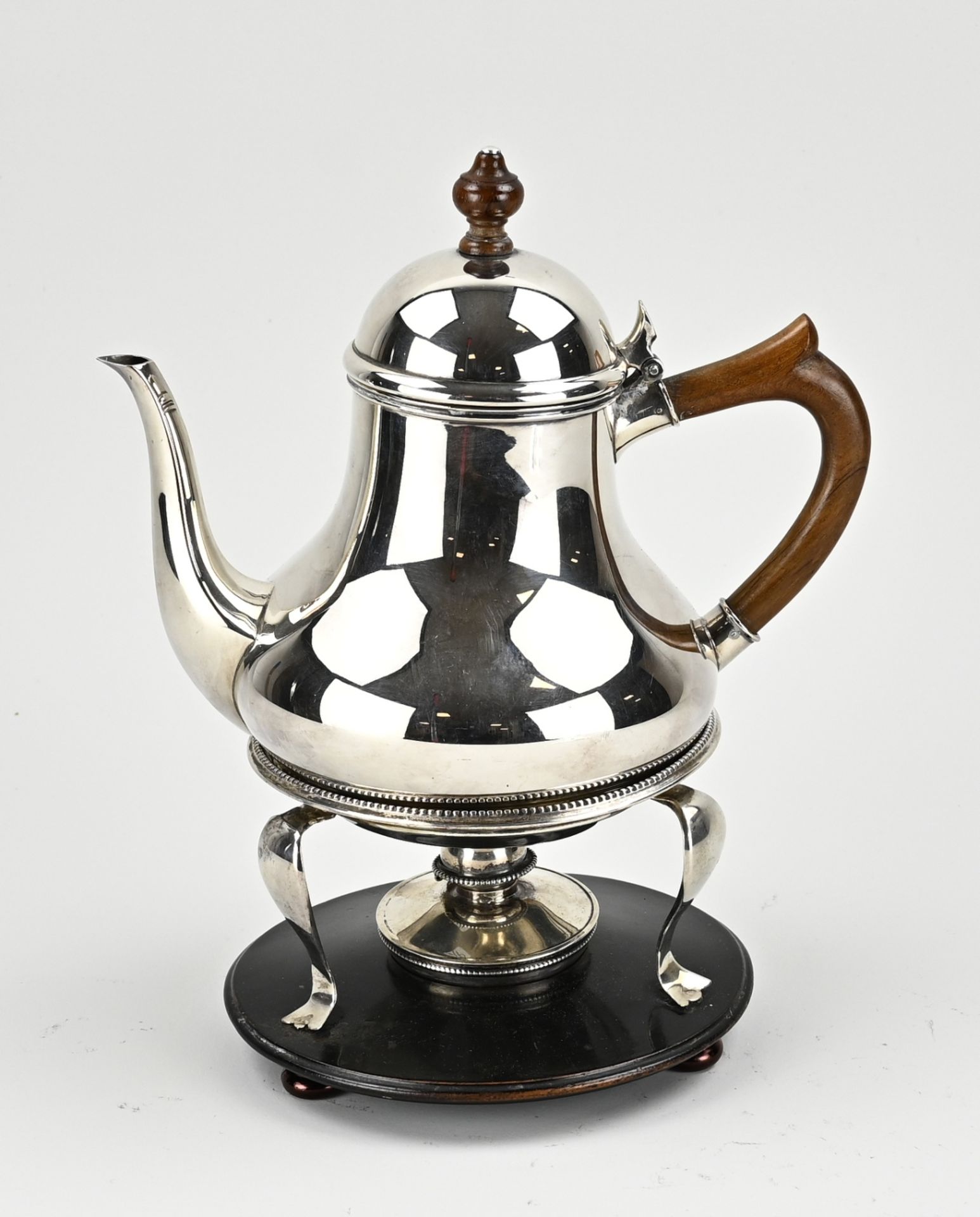 Silver teapot with stove