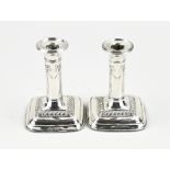 2 silver candlesticks