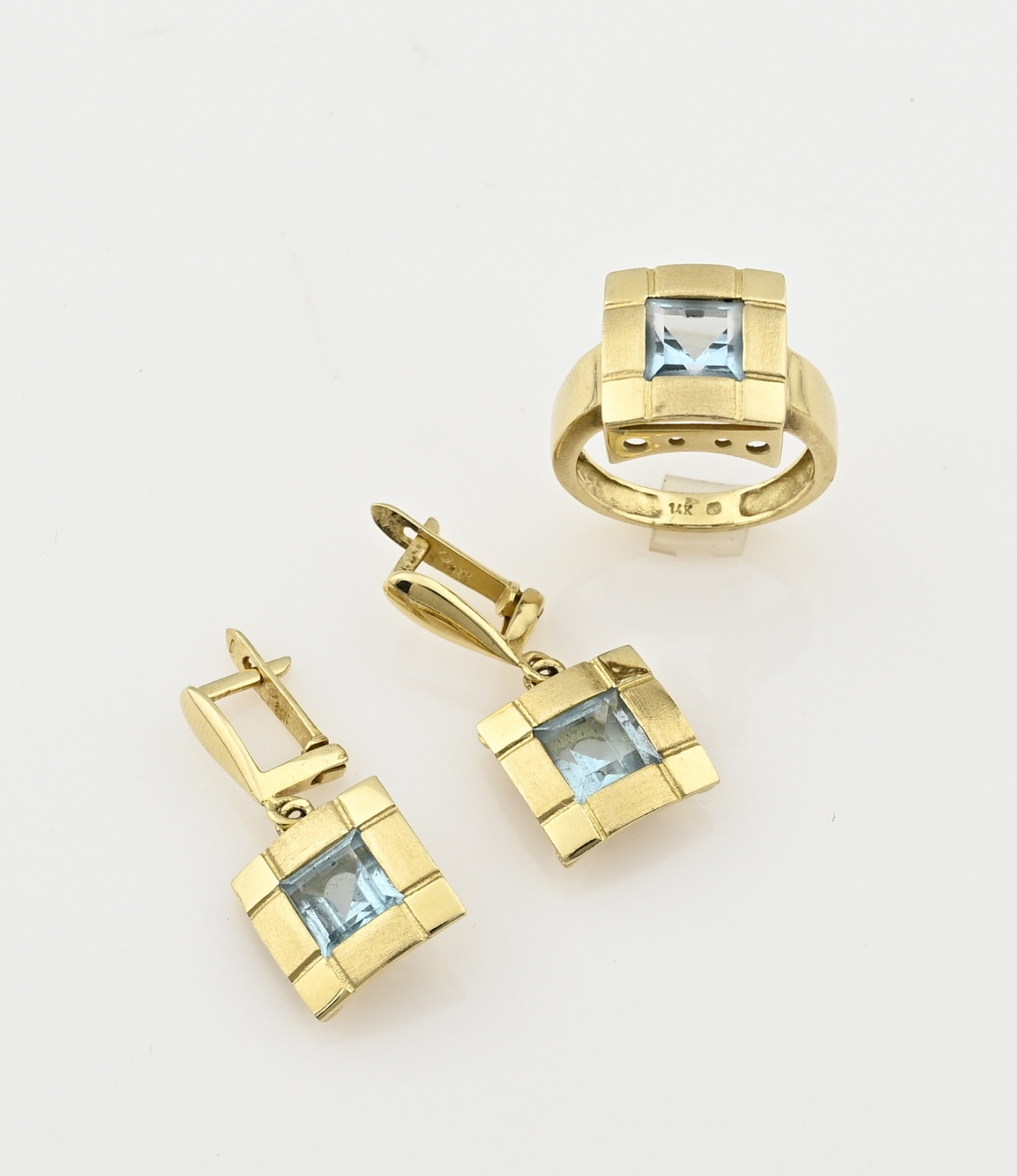 Set of gold jewelry with blue stone