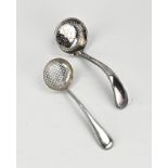 Two silver sprinkle spoons