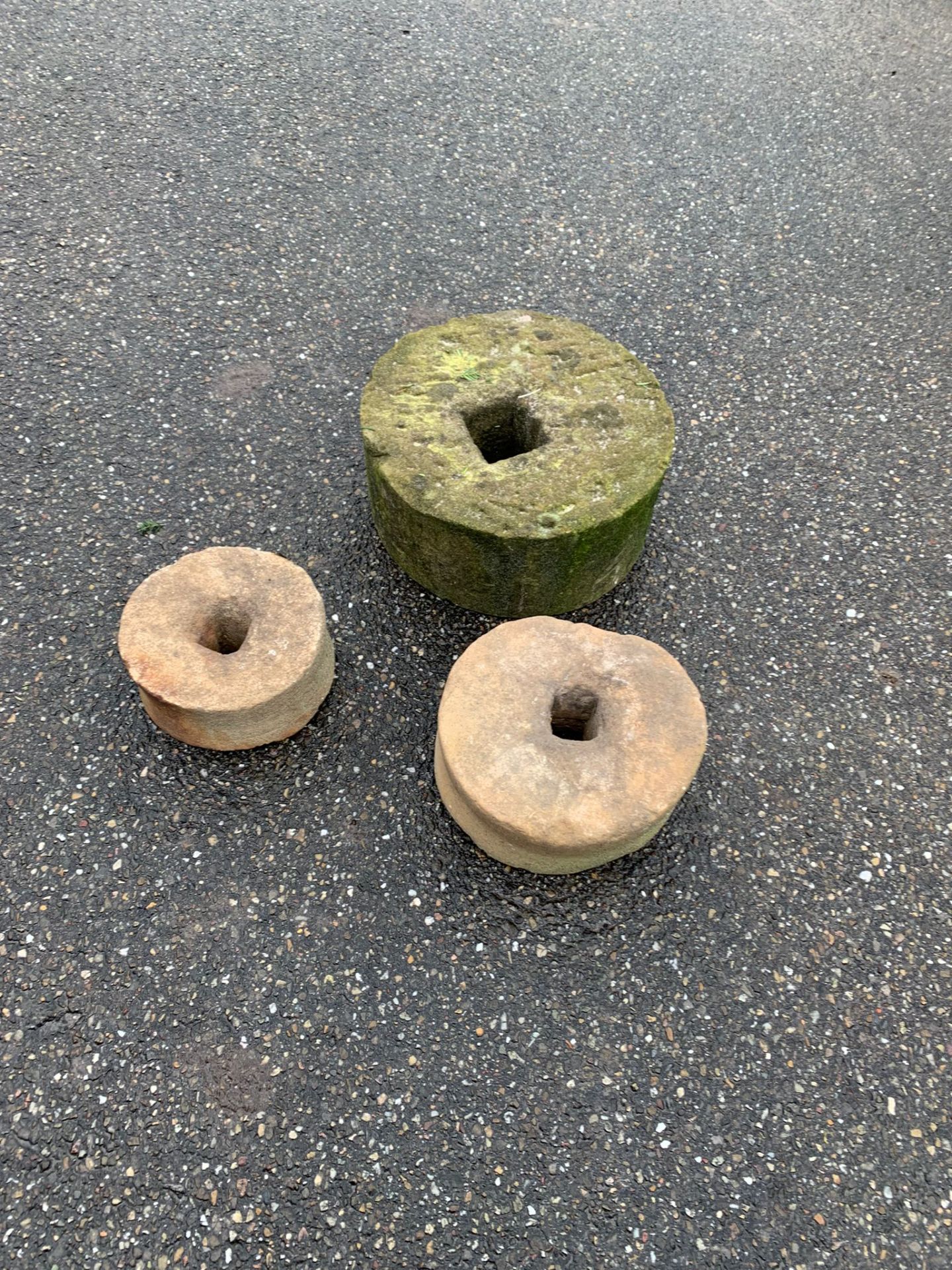 Three sandstone sharpening stones Ø 19 - Ø 33 cm.