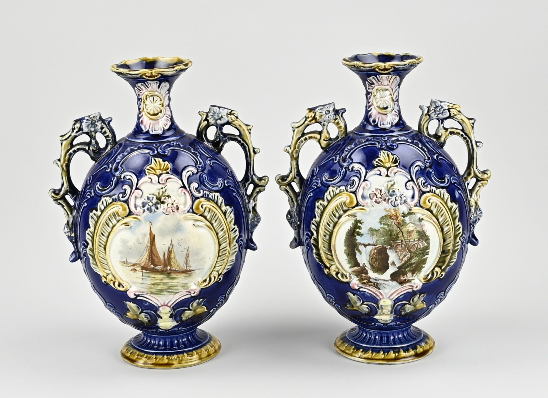 Two majolica vases, H 29 cm.