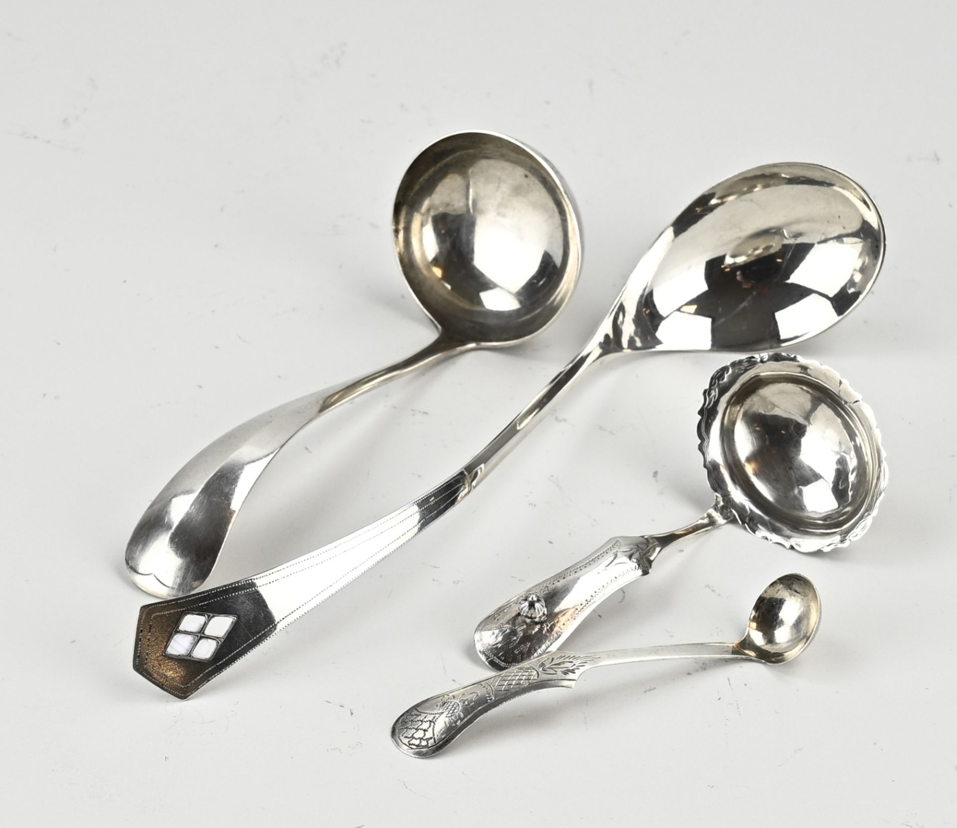 Four silver spoons