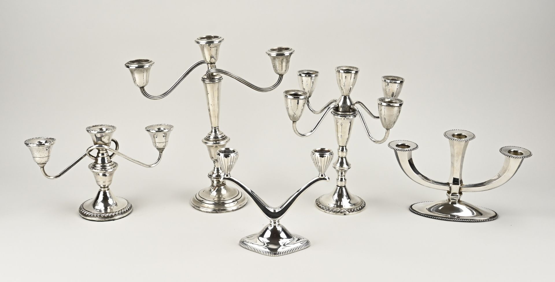 5 silver candlesticks