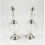 2 decanters with silverware