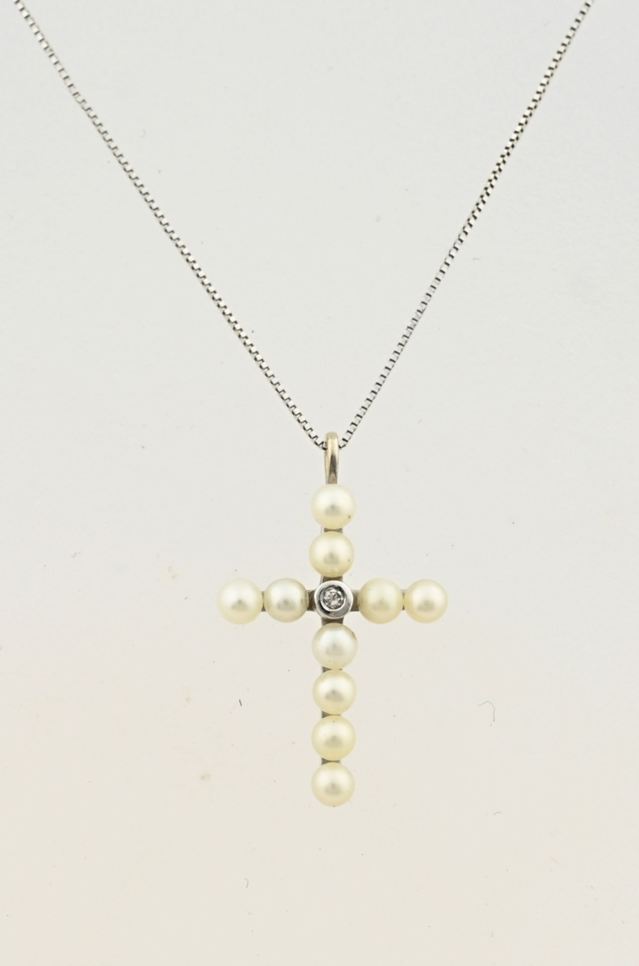 White gold necklace with cross