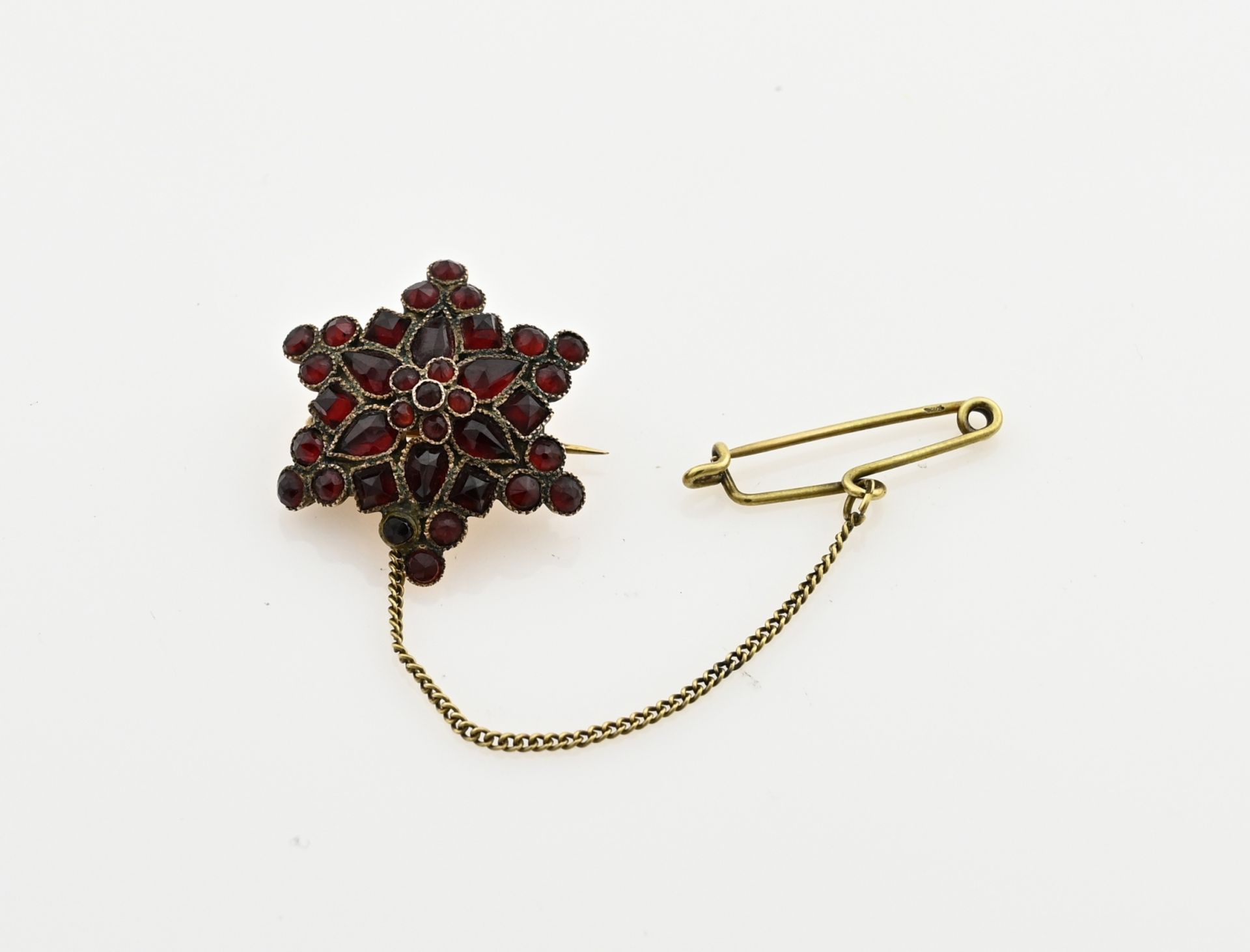 Gold garnet brooch