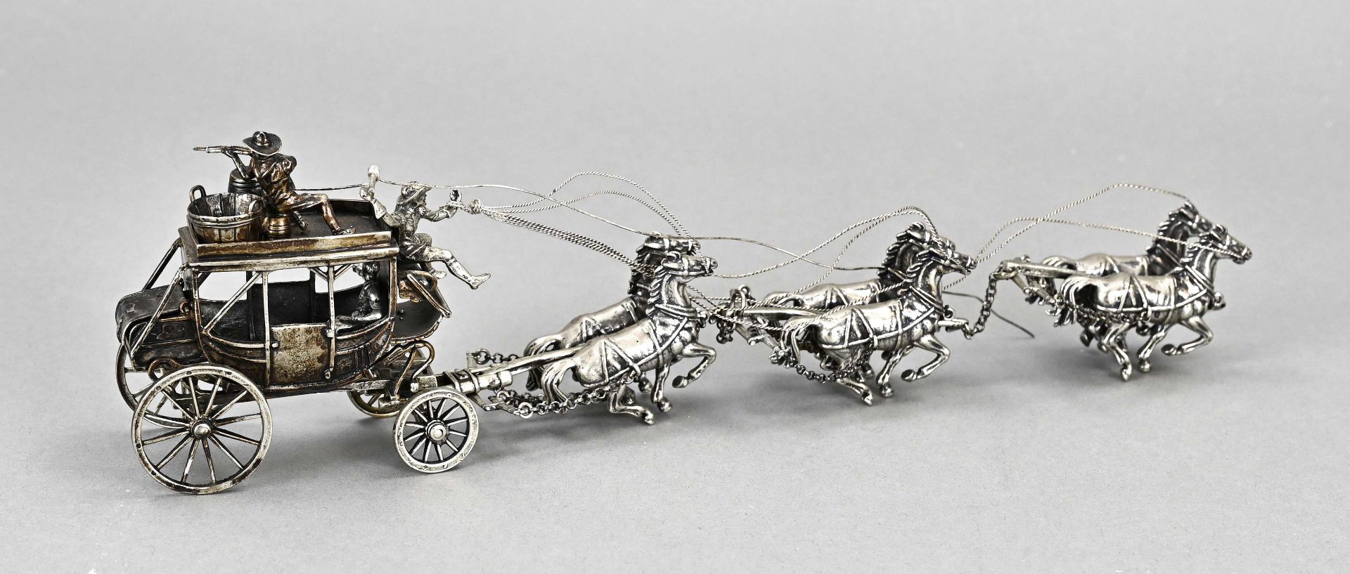 Silver carriage with horses