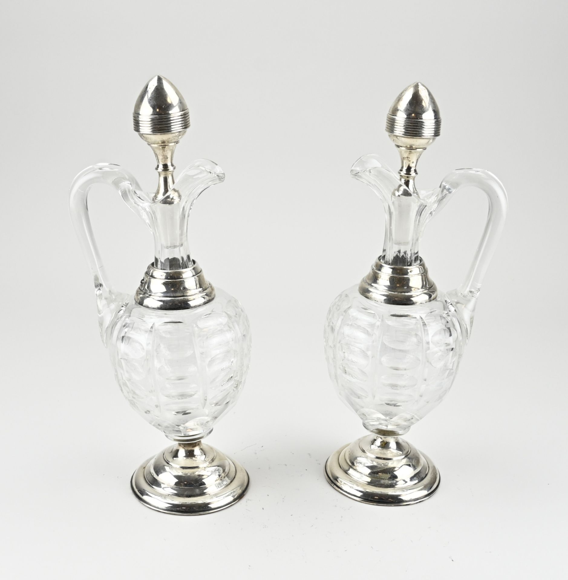 2 Decanters with silverware