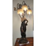 Large Spelter Art Nouveau Style Light standing on a circular base, illuminated with three lights.