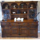 Stunning solid wood oak Sideboard with carved top. Measures 74 inches x 72 inches in height.