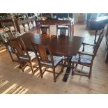 Oak Dining Table and 6 Chairs measuring 72 inches x 36 inches. Four dining chairs and two carvers.