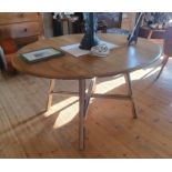 Ercol Oval Drop Leaf Dining Table, Product Number 377. Extended size is 48 inches x 44 inches.