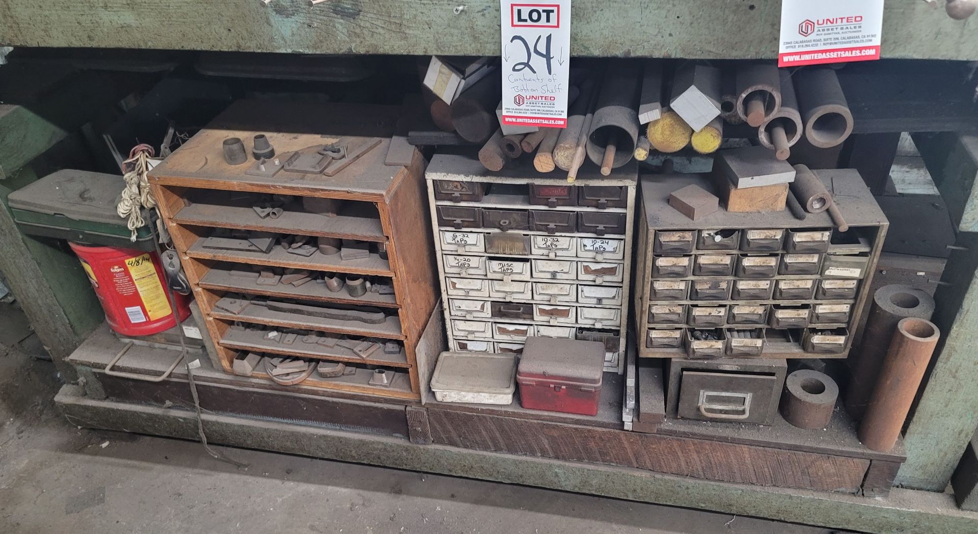 LOT - CONTENTS ONLY OF BOTTOM SHELF OF BENCH: HOLE PUNCHES, ROUND STEEL STOCK