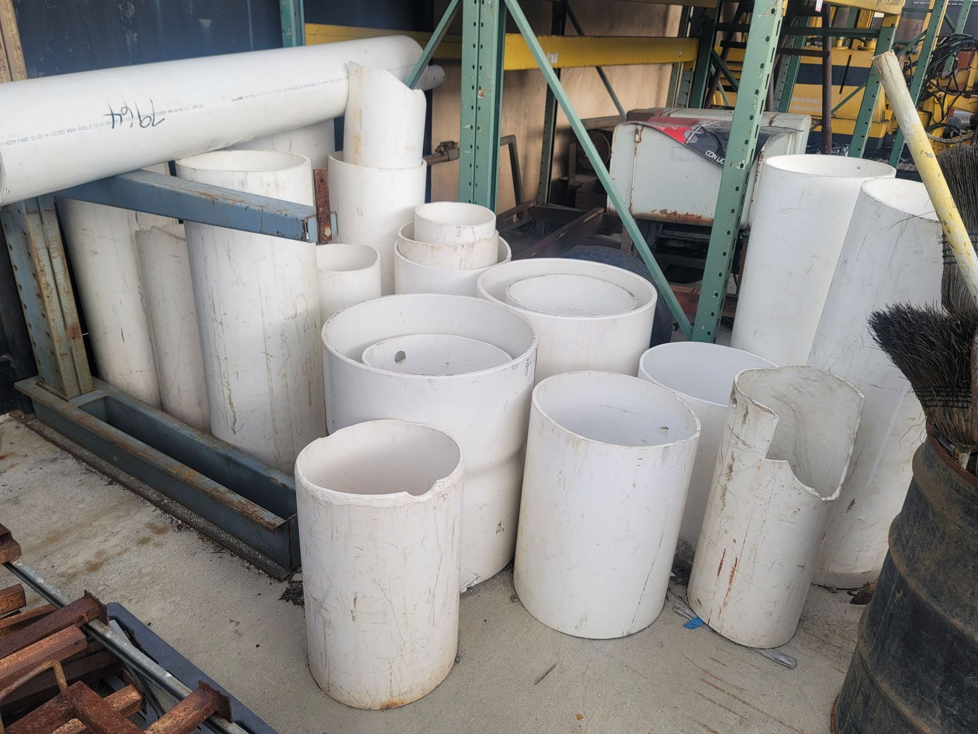 LOT - ALL PVC PIPE ON RACK AND GROUND, PLUS PVC COUPLINGS, RACKS NOT INCLUDED