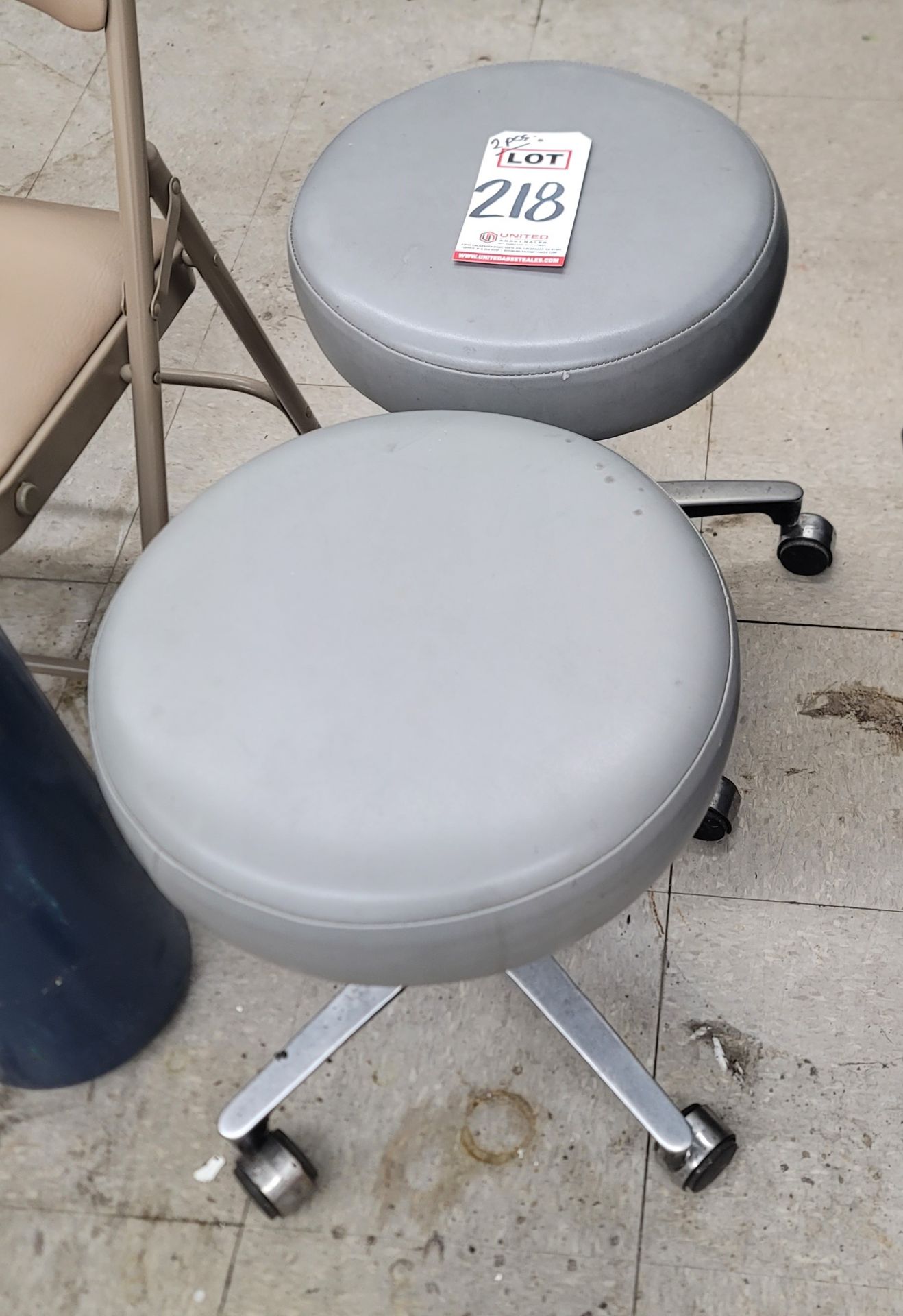 LOT - (2) UPHOLSTERED OPERATOR'S STOOLS, ON CASTERS