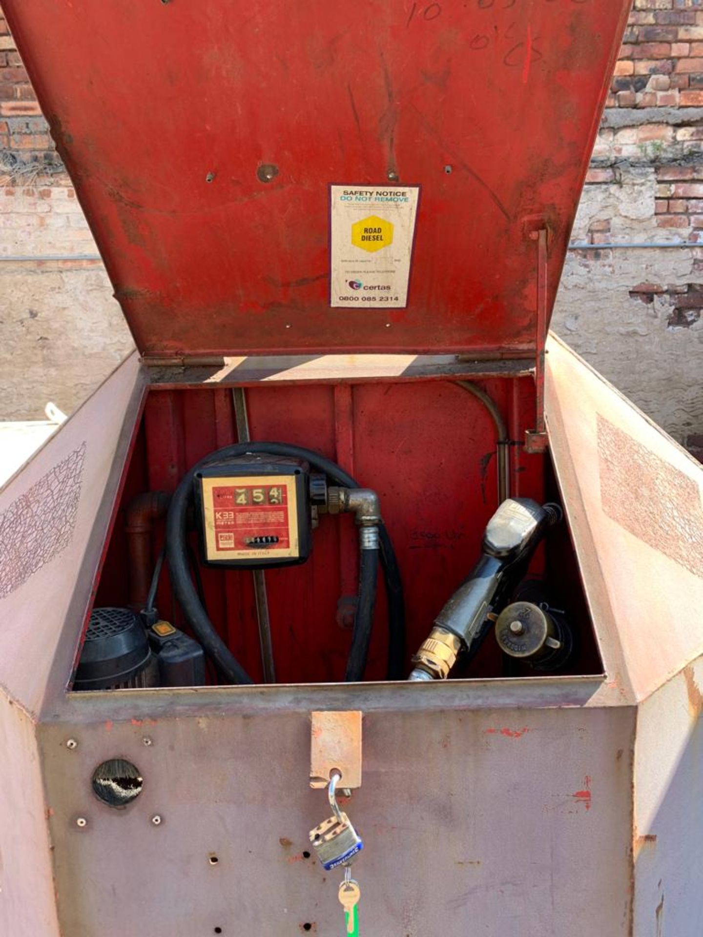 RED BUNDED FUEL TANK WITH FUEL DISPENSER PUMPS AND METERS