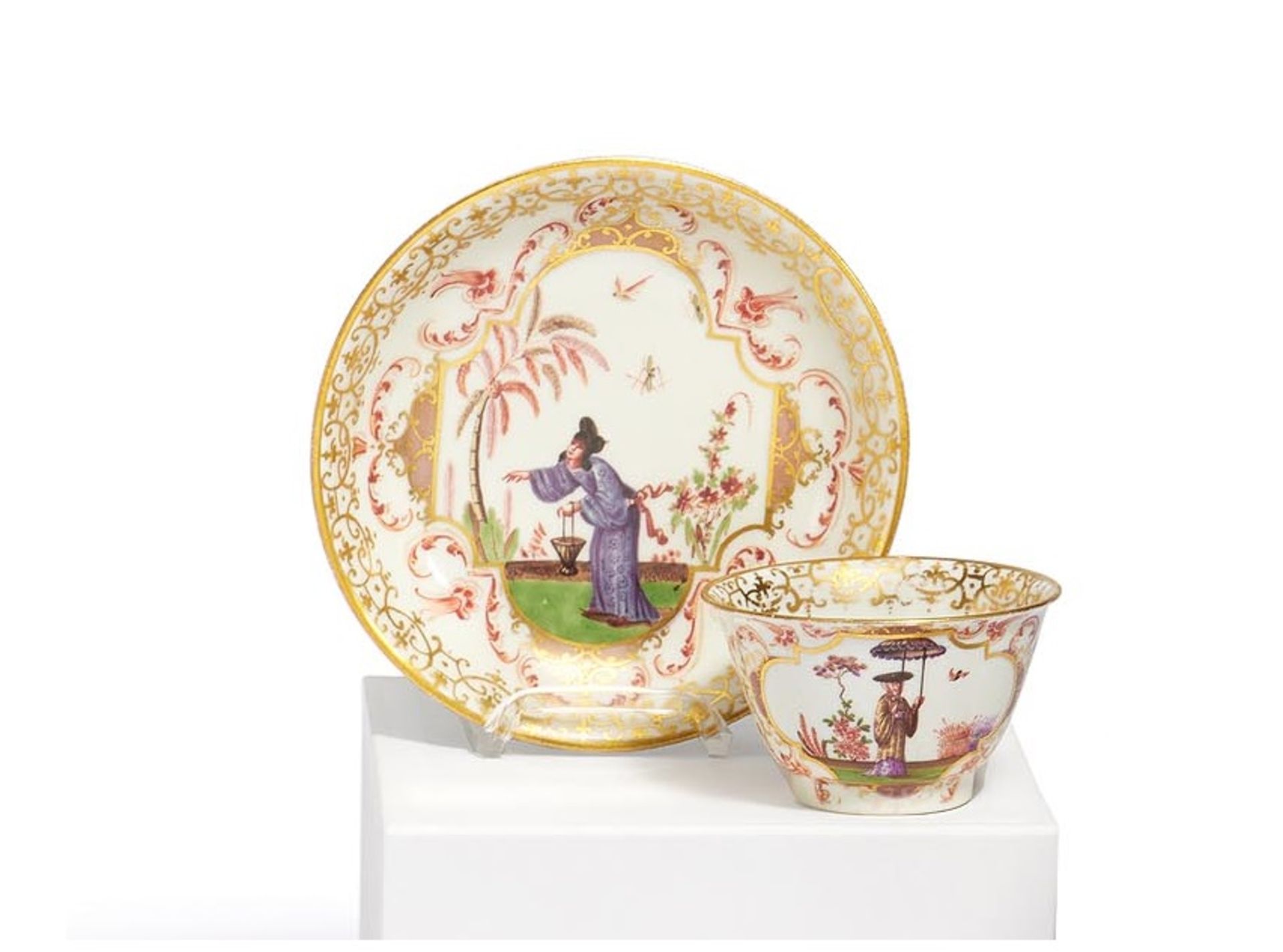 Meissen: PORCELAIN TEA BOWL AND SAUCER WITH LARGE CARTOUCHES OF CHINOISERIES