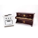 GermanyTOY PIANO MADE OF WOOD, BRASS AND PLASTIC AND A DOLL'S COOKING STOVE MADE OF SHEET METAL WITH