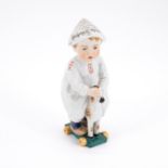 Meissen: SMALL PORCELAIN BOY WITH NEWSPAPER HAT ON A LITTLE WOODEN HORSE