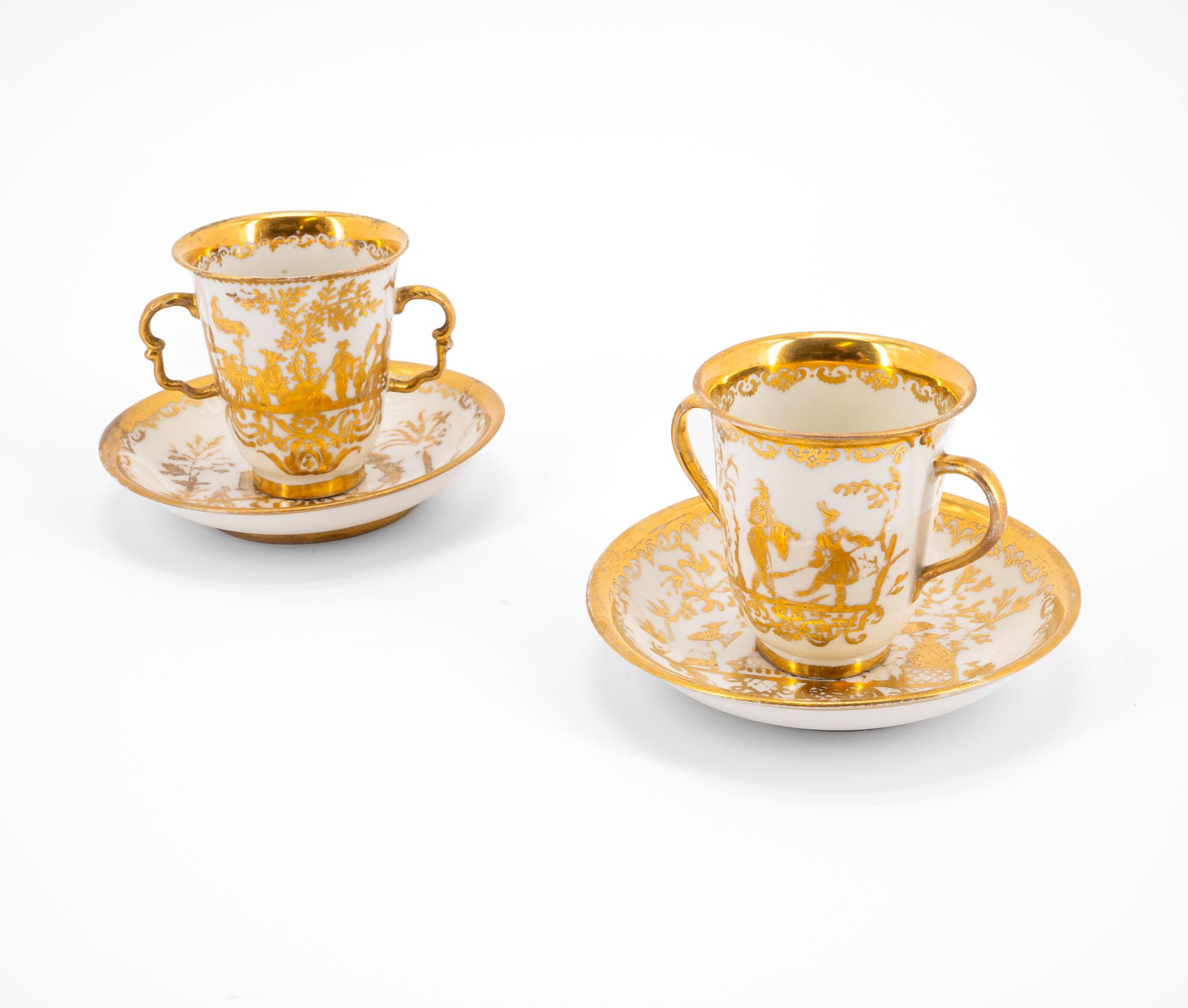 Meissen: TWO PORCELAIN BEAKERS WITH DOUBLE HANDLE AND SAUCERS WITH GOLDEN CHINOISERIES