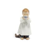 Meissen: PORCELAIN FIGURINE OF A BOY DRINKING FROM AN ONION PATTERN CUP