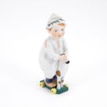 Meissen: PORCELAIN HENTSCHEL CHILD WITH NEWSPAPER HAT ON TOY HORSE