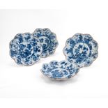 SUITE OF FOUR BLUE-WHITE PLATE WITH FLOWER-SHAPED RIM