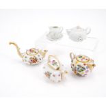 Meissen: THREE PORCELAIN MINIATURE TEAPOTS AND MINIATURE TABLEWARE