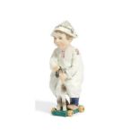 Meissen: PORCELAIN FIGURINE OF A SMALL BOY WITH WOODEN HORSE