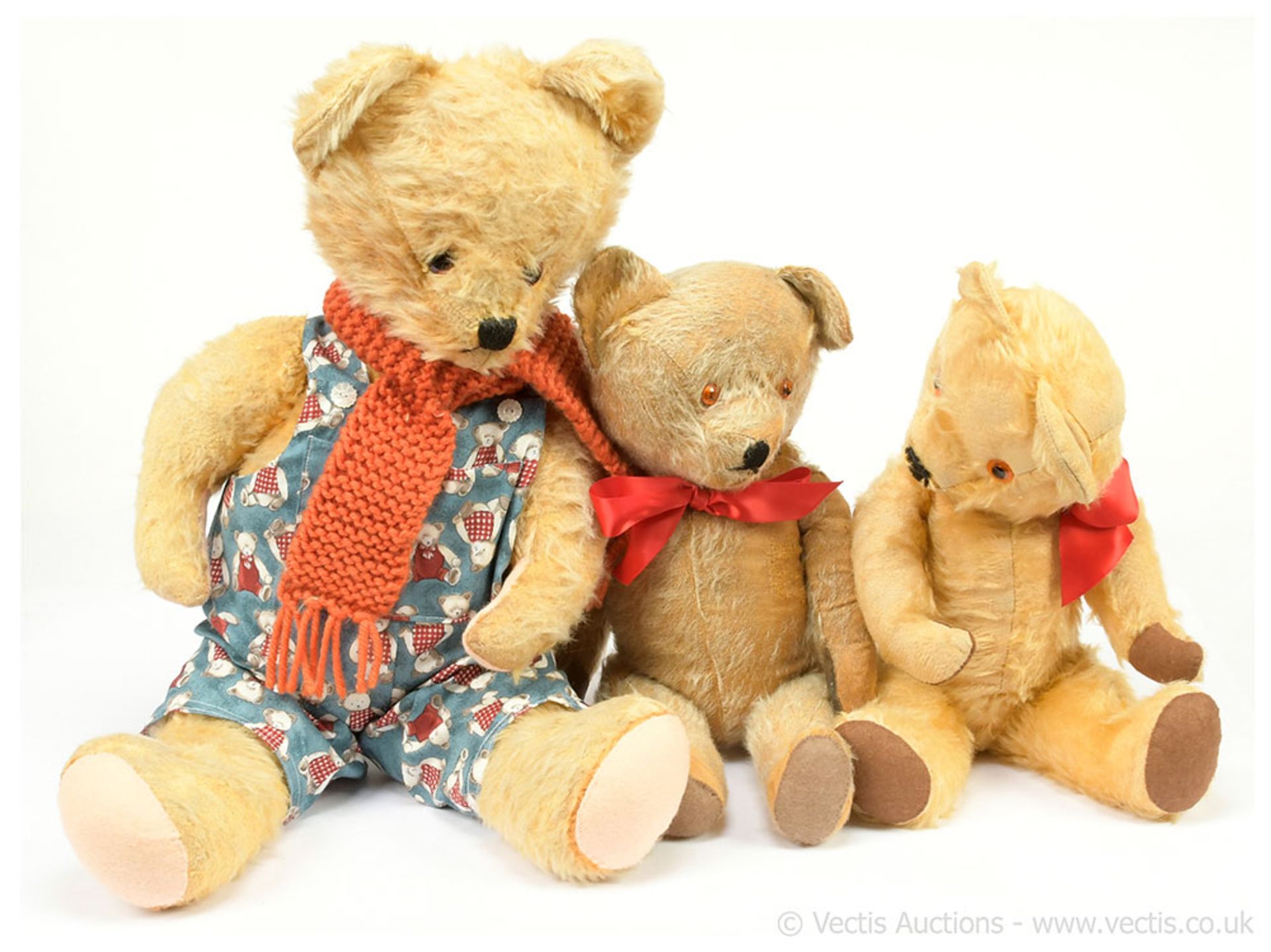 GRP inc Three vintage teddy bears: (1) golden