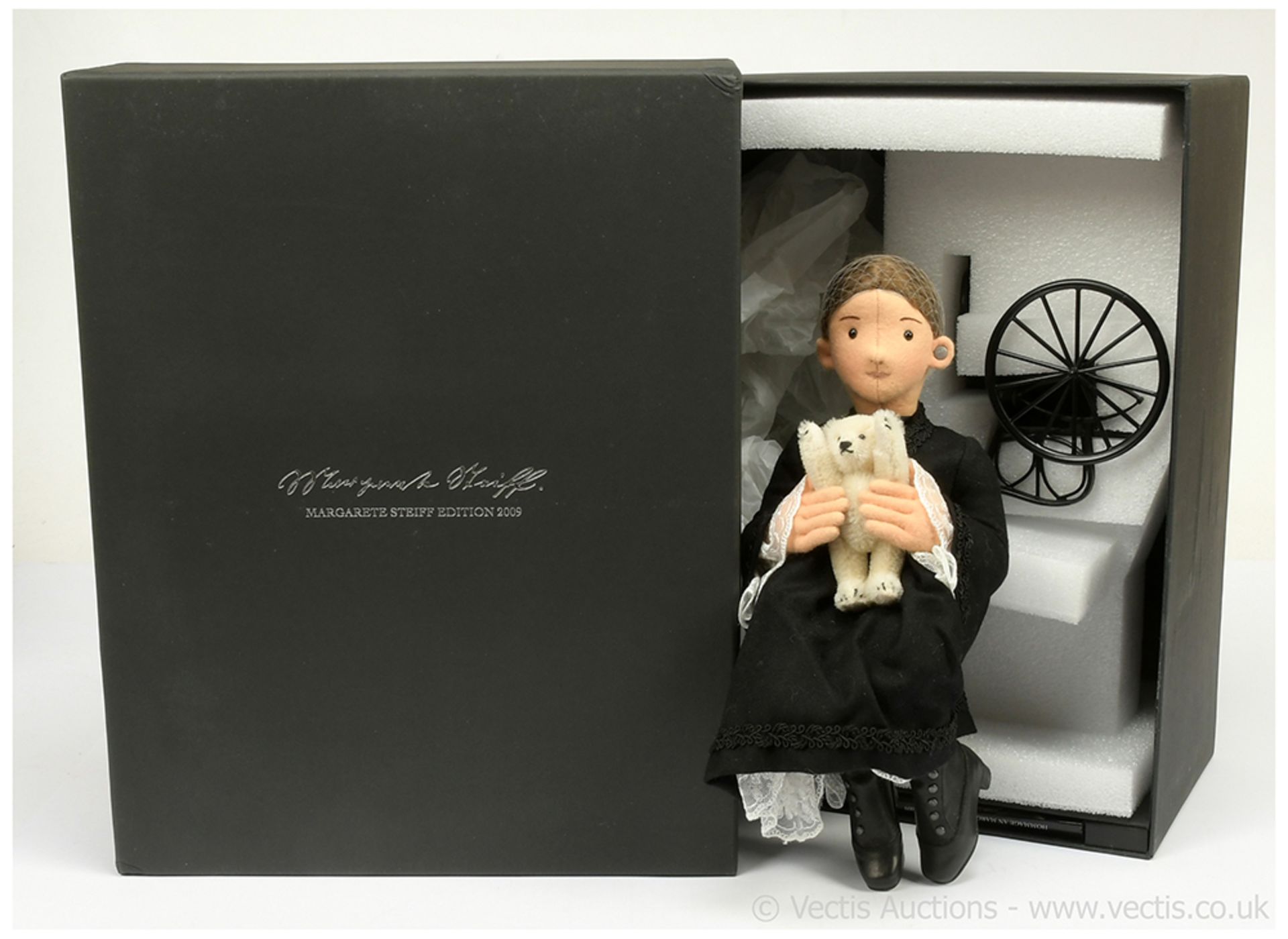 Steiff Margarete felt doll holding a miniature