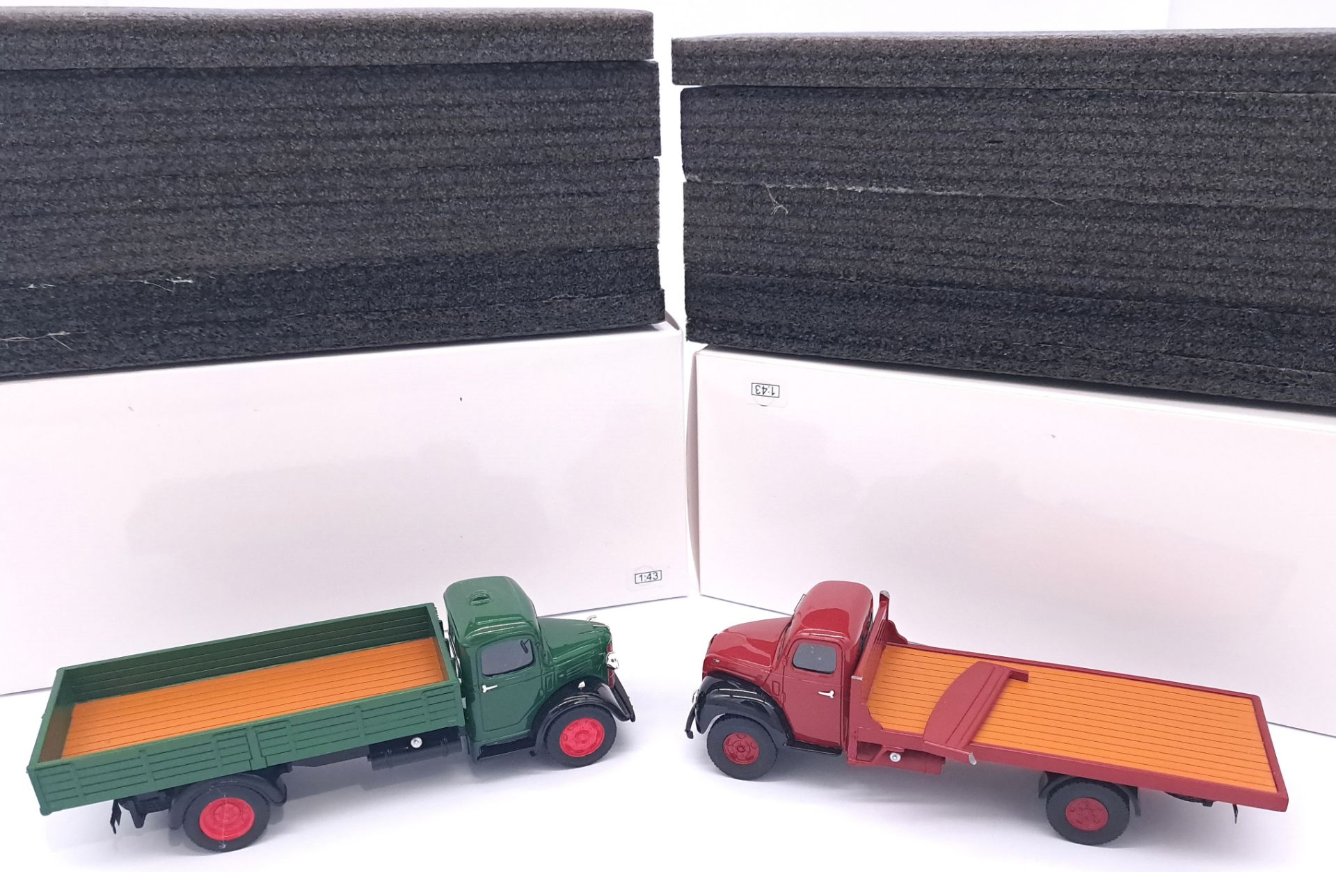 Resin. A pair of boxed Resin constructed lorries