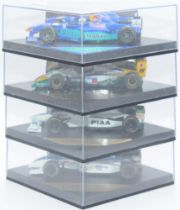 Onyx a boxed group of F1 cars singed by the drivers to include