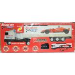 Mrmtruck3- a boxed Radio Controll 1:18th Scale Racing Car with Car Transporter 