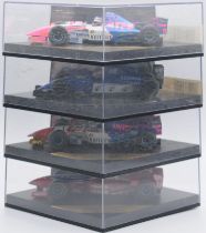 Onyx a boxed group of F1 cars singed by the drivers to include