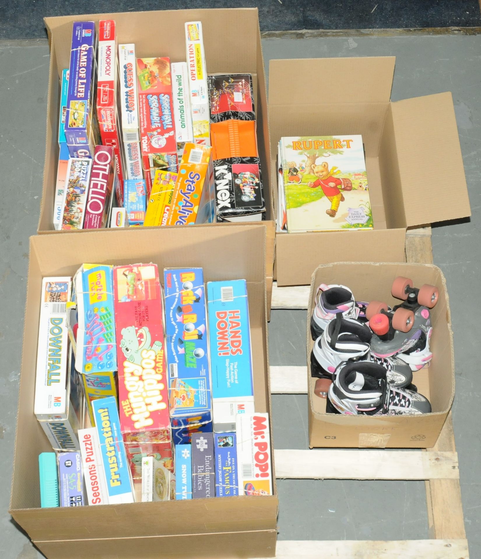 A pallet lot to include board games, puzzels, books, roller skates and others