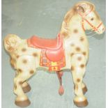 An unboxed Tinplate Rocking Horse